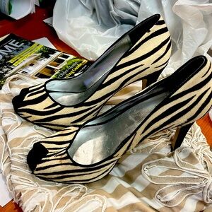 Guess high heel.  Zebra skin slight stain.
